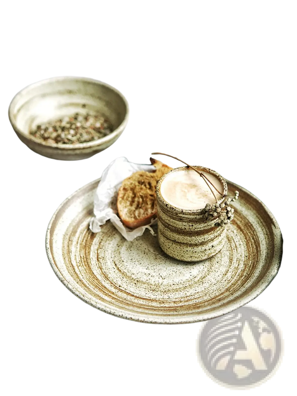 Rustic ceramic coffee cup with concentric brown and beige glaze swirls and speckled stoneware, floral accent on rim