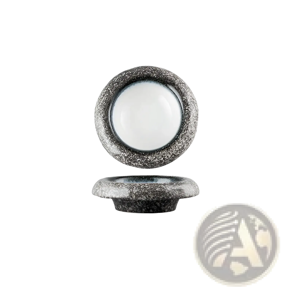 A ceramic sashimi bowl featuring a rustic speckled gray stone plate with a smooth white interior and raised rim