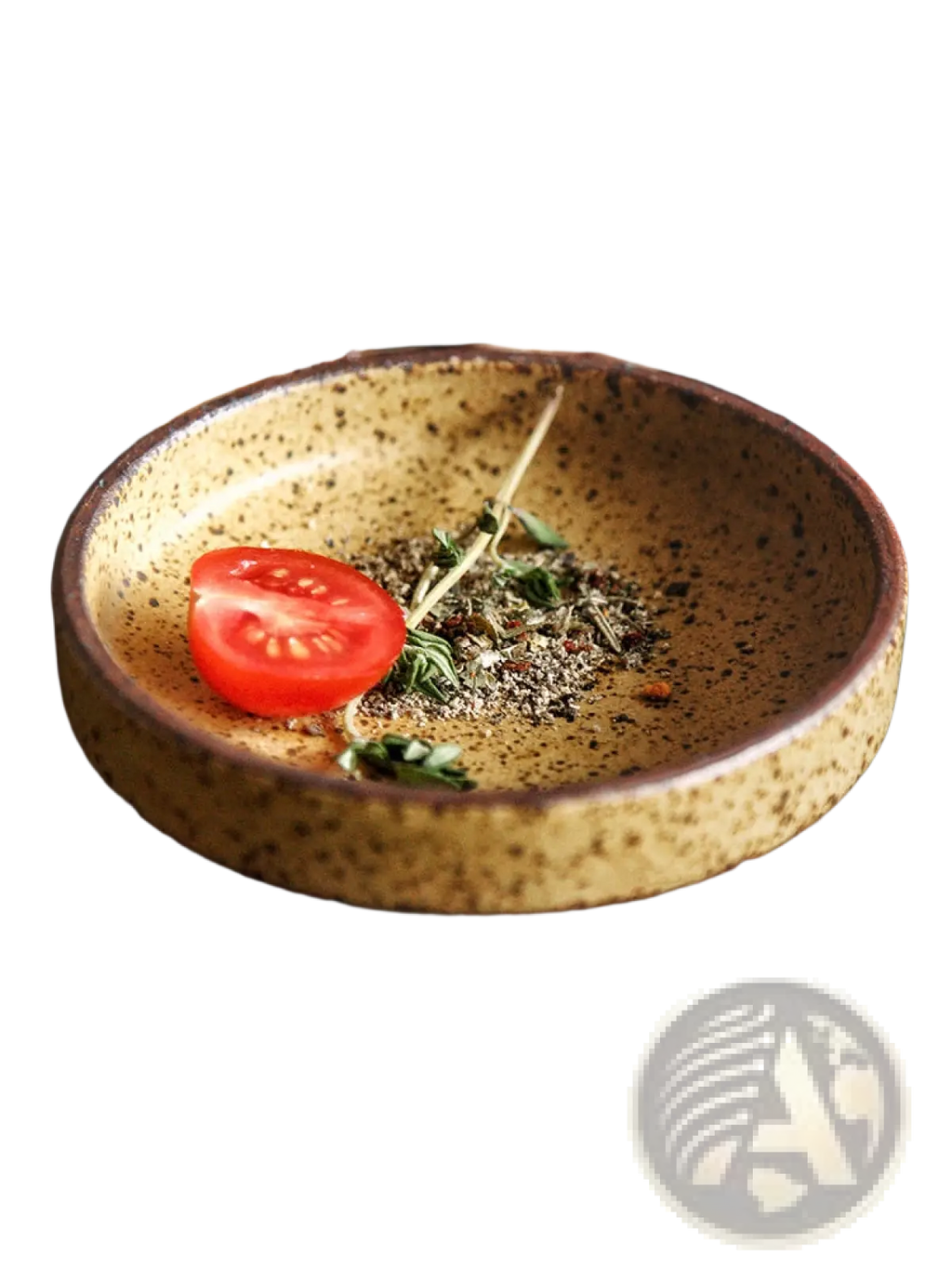 Ceramic sauce dish rustic Japanese dipping bowl speckled yellow ceramic with dark brown rim holding halved cherry tomato and herbs