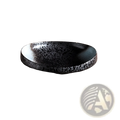 A sleek black ceramic speckled serving bowl with a glossy finish on a rustic wooden surface for home kitchens