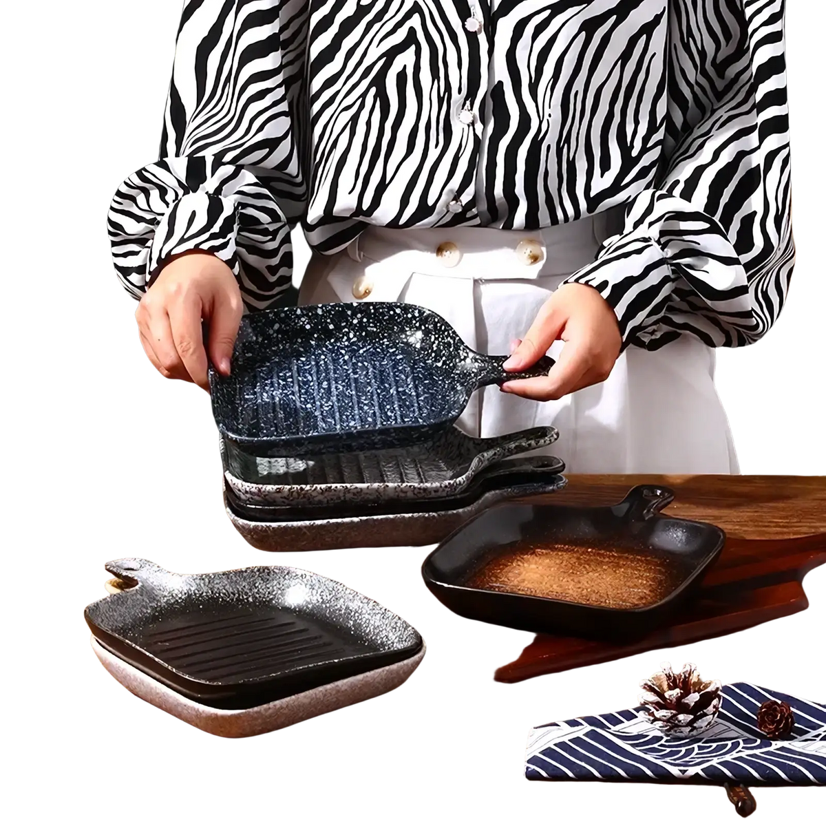 Black speckled ceramic square baking plate with handle featuring a textured ribbed cooking surface for grilling