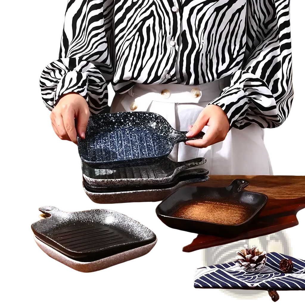 Black speckled ceramic square baking plate with handle featuring a textured ribbed cooking surface for grilling