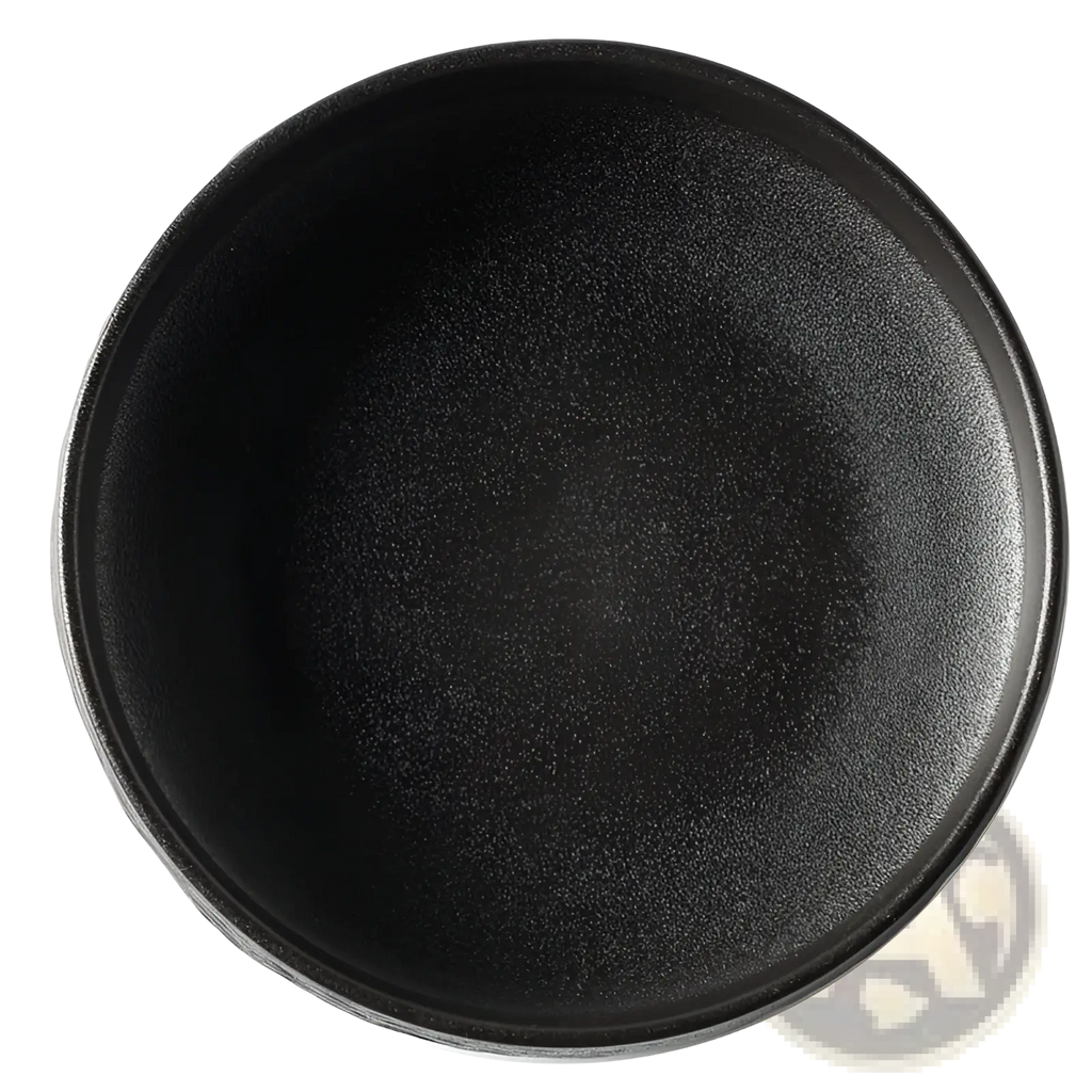 A matte black ceramic deep plate with a speckled stone pattern and rounded rim for Japanese tableware