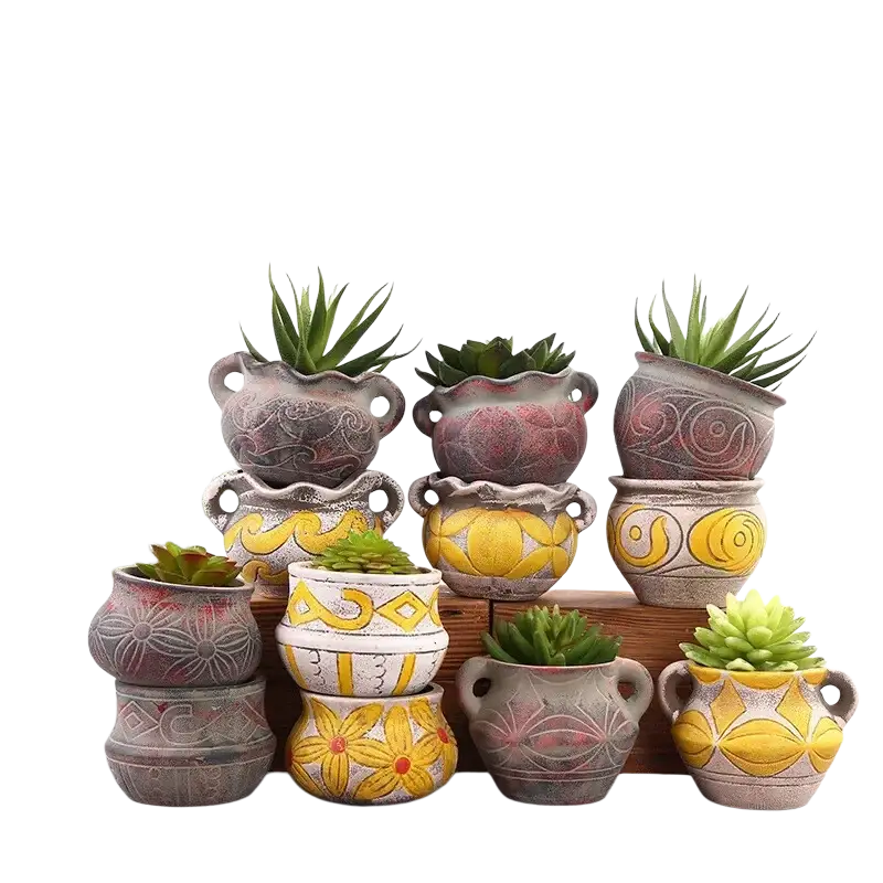 A collection of rustic ceramic succulent planter pots with hand-painted geometric and floral patterns avoiding packaging damage