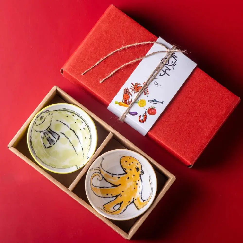 Hand-painted marine ceramic bowl gift set with yellow fish and orange octopus designs in wooden box with red packaging