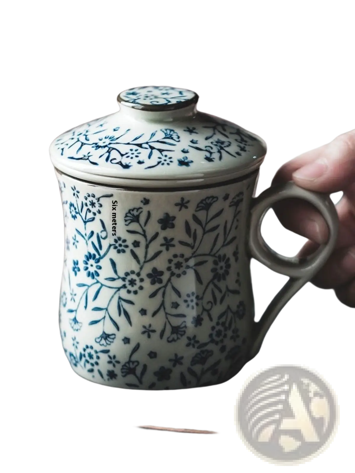 White ceramic tea mug with infuser and lid featuring delicate blue floral patterns and a sturdy handle 300ml