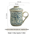 Cream-colored ceramic tea mug with blue floral pattern and matching lid, includes infuser, 300ml capacity