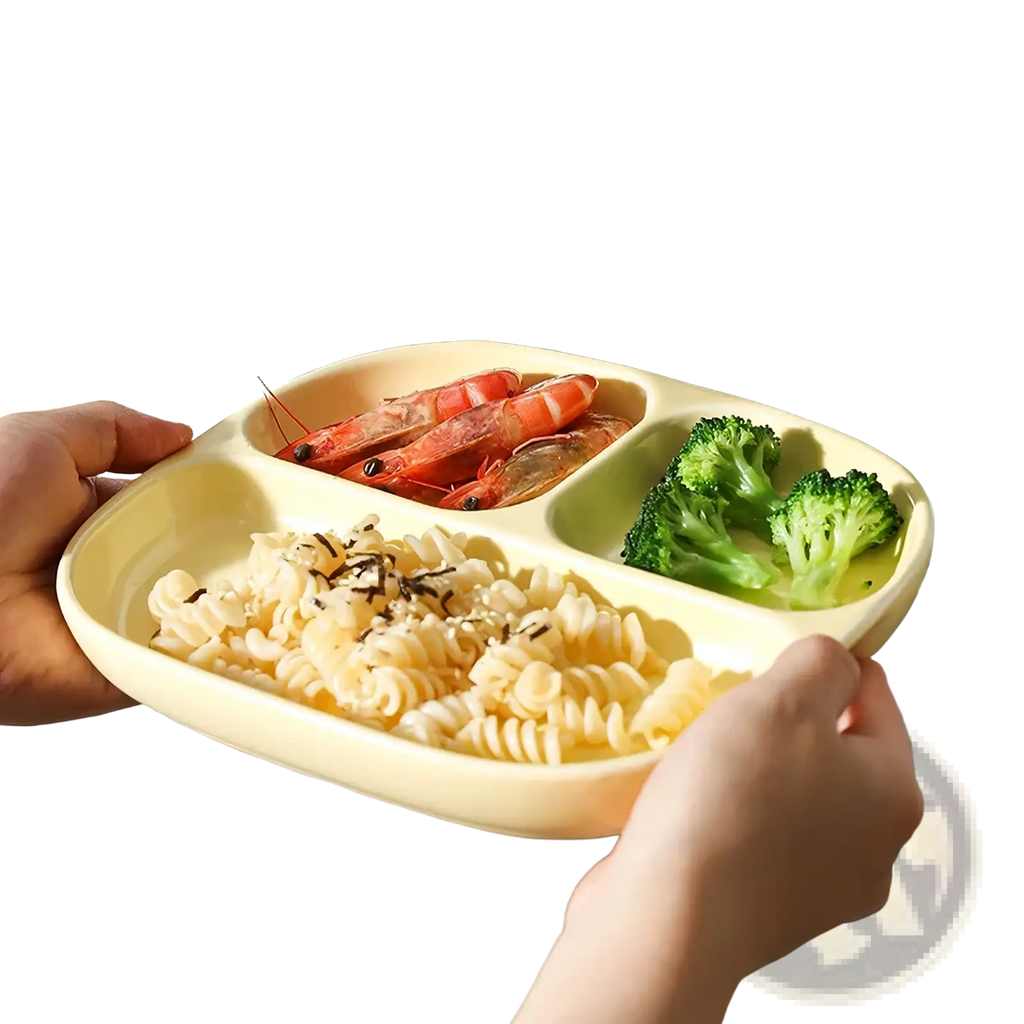 Cream-colored ceramic three compartment divided portion plate holding pasta shrimp and broccoli in each section