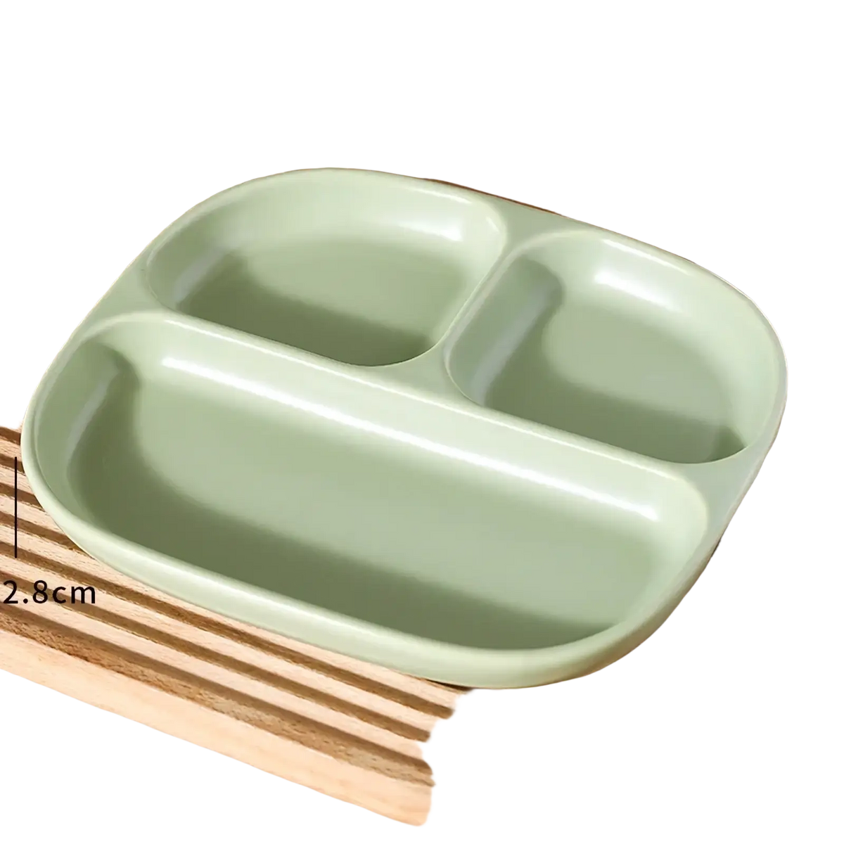 A light green ceramic three compartment divided portion plate with rounded edges and a smooth surface