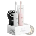 White marble-textured ceramic toothpaste holder organizer with electric shaver and toothbrushes for bathroom use