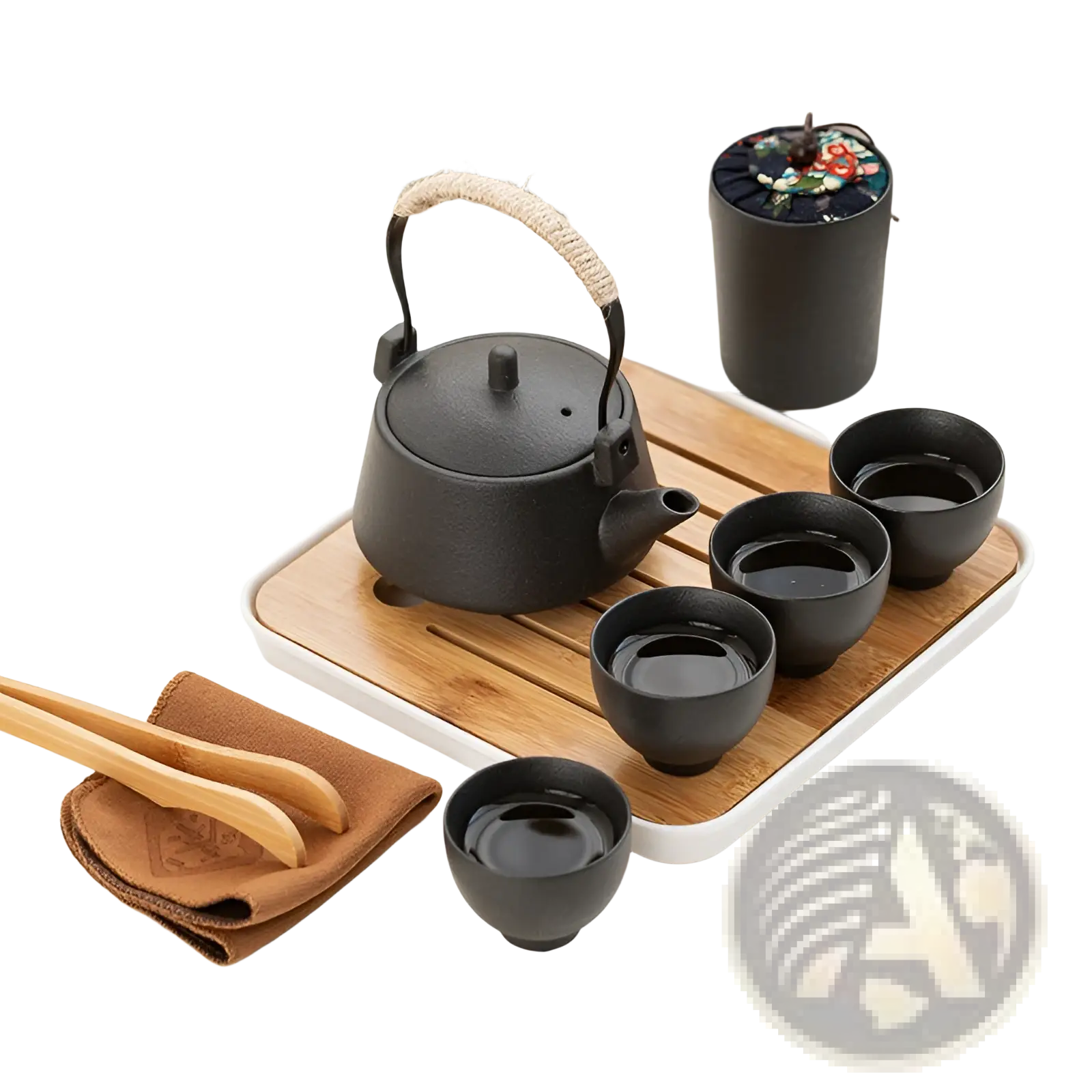 Black cast iron teapot with textured surface and rope wrapped handle from ceramic travel tea set with bamboo tray and case