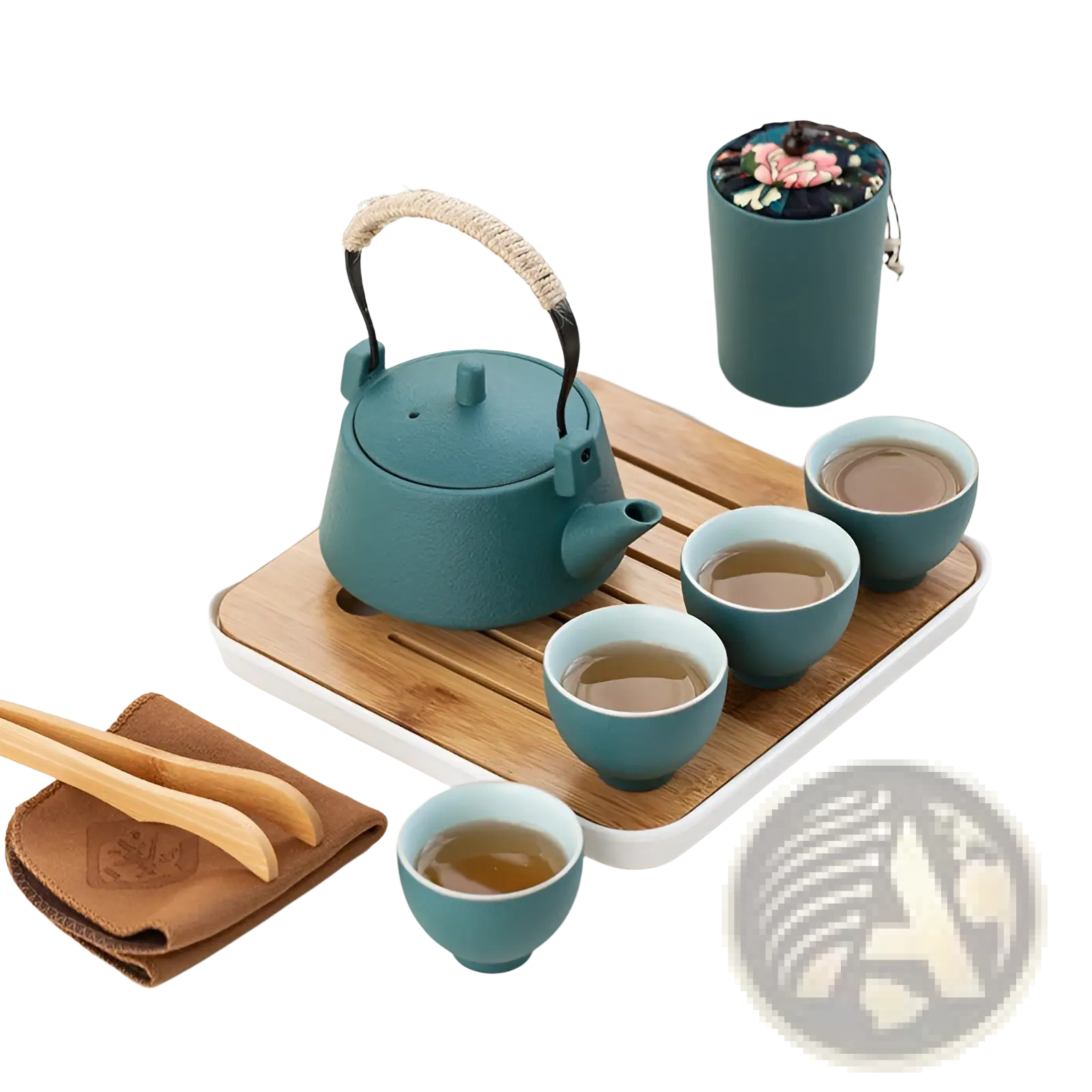 Teal cast iron tea kettle with rope-wrapped handle and black metal accents from ceramic travel tea set with bamboo tray
