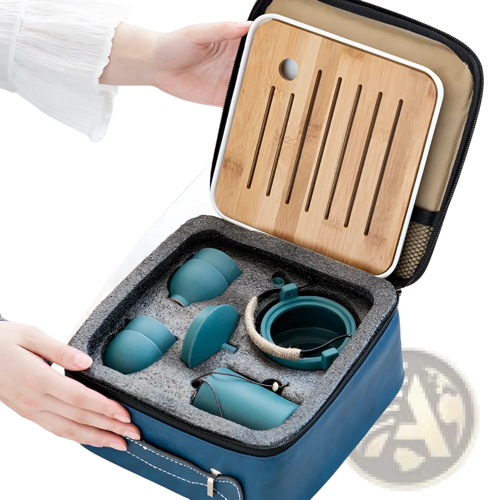 Teal ceramic travel tea set with matching bamboo tray neatly arranged in a blue fabric carrying case