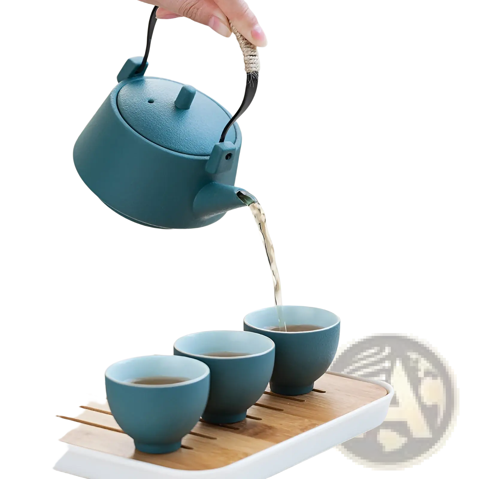 Teal ceramic travel tea set with bamboo tray featuring a teapot with woven rope handle pouring tea into matching cups