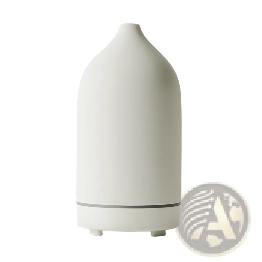 Cream-colored ceramic ultrasonic aroma diffuser and humidifier with sleek rounded body and gray accent band near the base