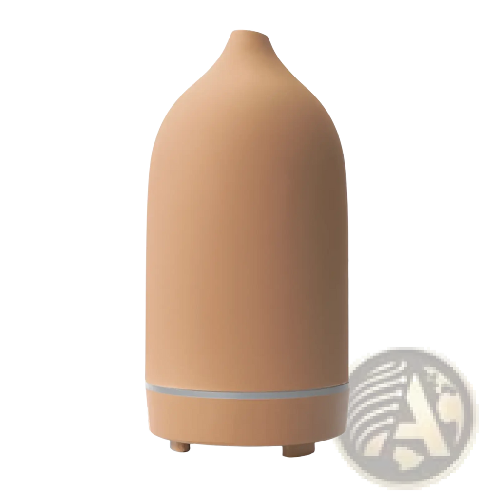 Tan ceramic ultrasonic aroma diffuser and humidifier with a sleek tapered design and silver accent band near the base