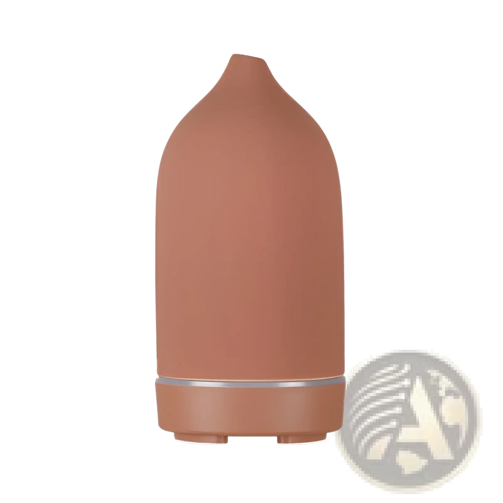 Terracotta-colored ceramic ultrasonic aroma diffuser and humidifier with sleek rounded design and silver accent band near base
