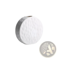 A white ceramic vase with a textured hammered surface and rounded shape in minimalist Scandinavian style
