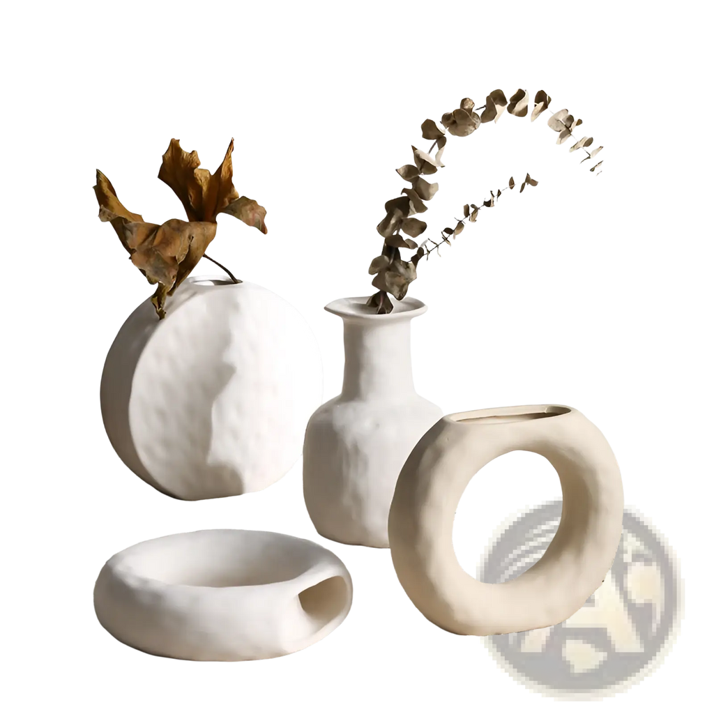 White ceramic vases with textured organic shapes and matte finishes in a minimalist scandinavian pottery style