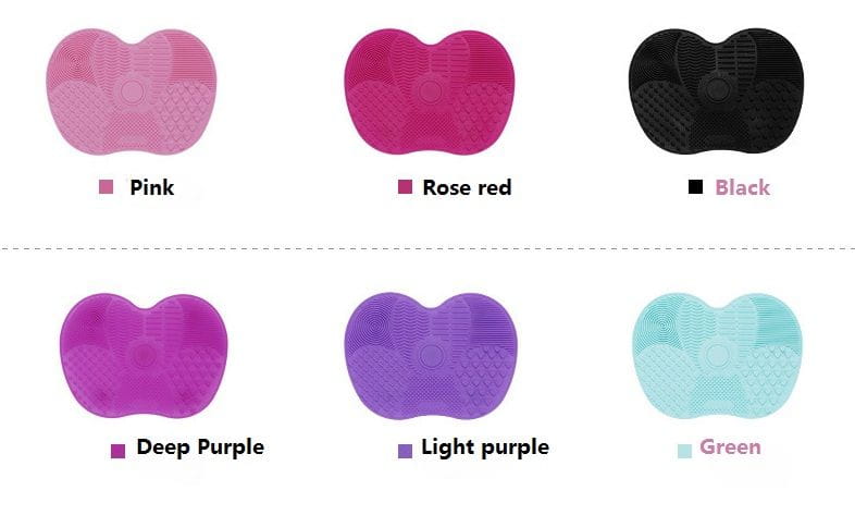 A heart-shaped silicone facial cleansing brush available in pink, rose red, black, deep purple, light purple, and green for makeup brush cleaning.