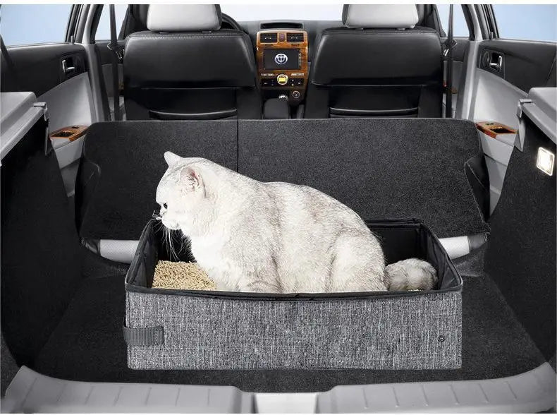 A white fluffy cat sitting inside a foldable waterproof gray fabric cat litter box.