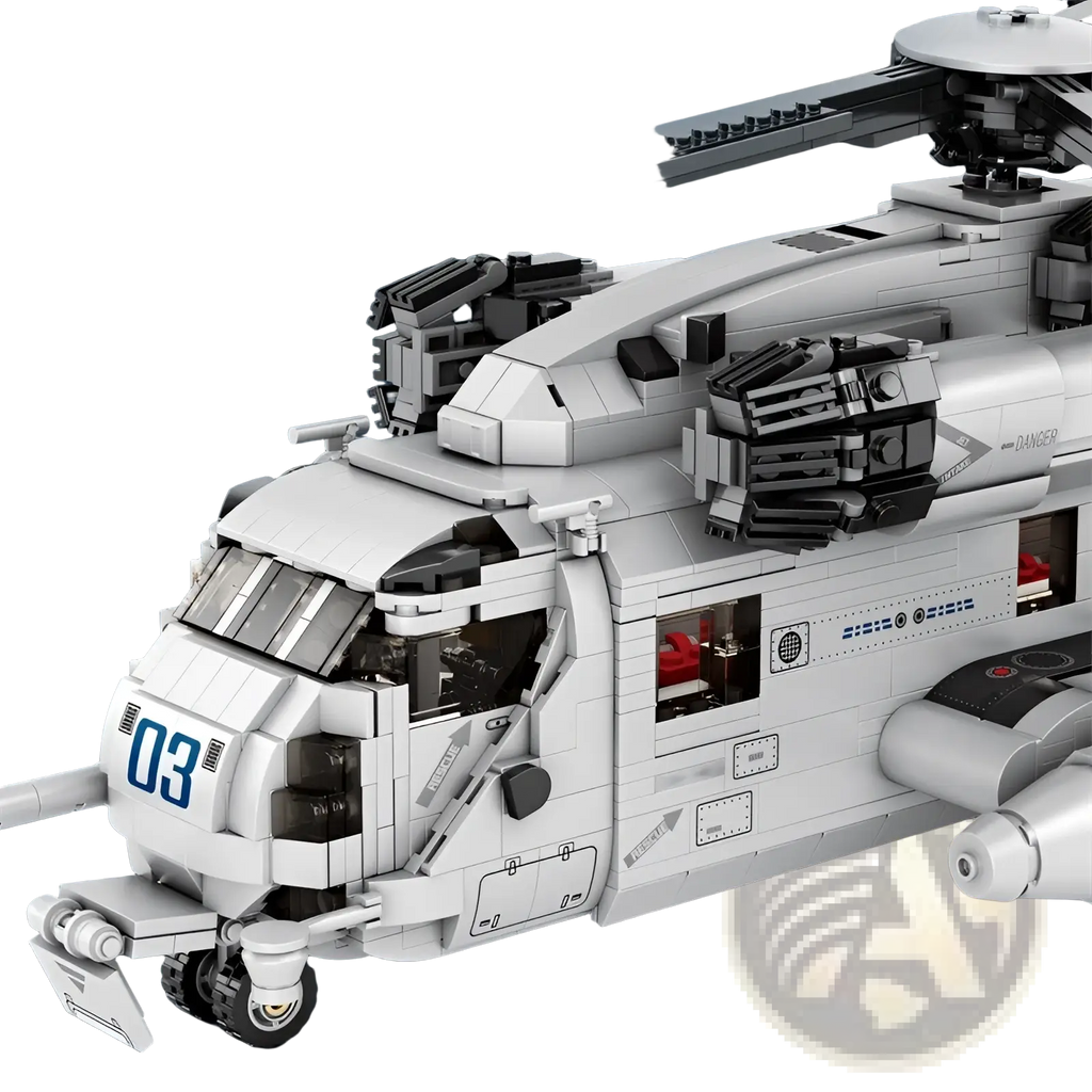 White and black lego ch-53 transport helicopter model toy with detailed cockpit, rotor blades, and mounted weapons
