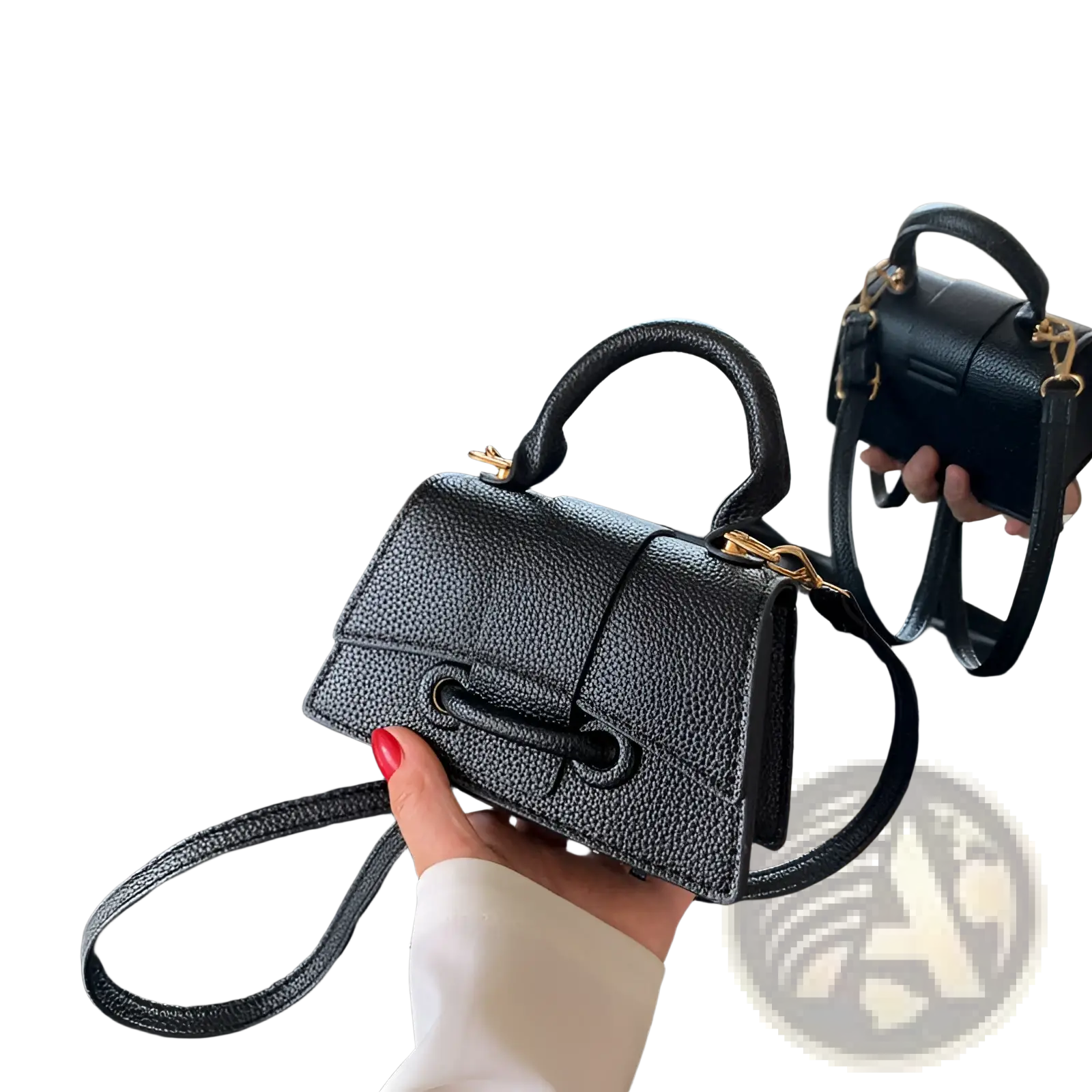 Black pebbled leather mini chain messenger bag with gold tone hardware and top handle for casual use