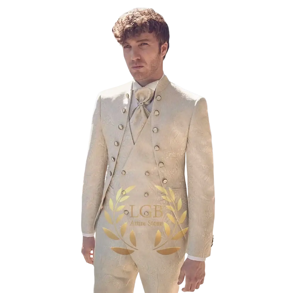 A cream-colored champagne double breasted tuxedo suit featuring gold toned buttons and an intricate woven pattern