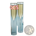 Two clear double walled champagne flutes filled with golden liquid in 115ml glass set on a table