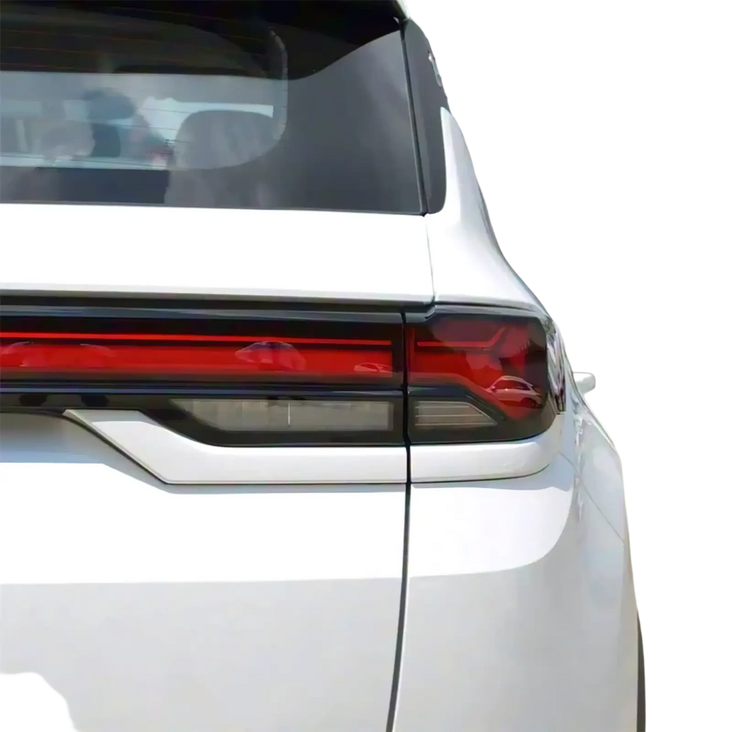 Back side of a white Changan Cs35 Plus taillight shell 2021 2023 with sharp red and black led lighting and chrome trim
