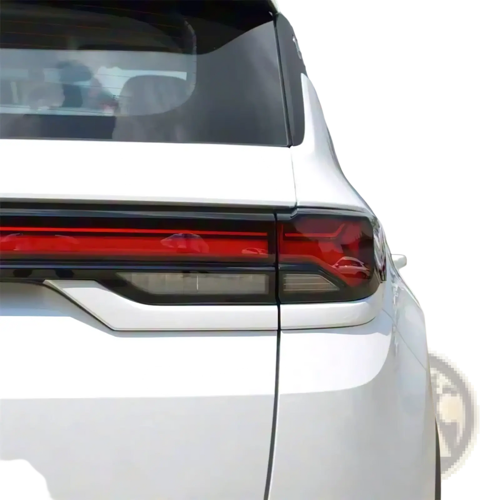 Back side of a white Changan Cs35 Plus taillight shell 2021 2023 with sharp red and black led lighting and chrome trim