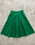 Charlotte Nova emerald green high waisted a-line skirt made of smooth satin-like fabric with a vibrant emerald color