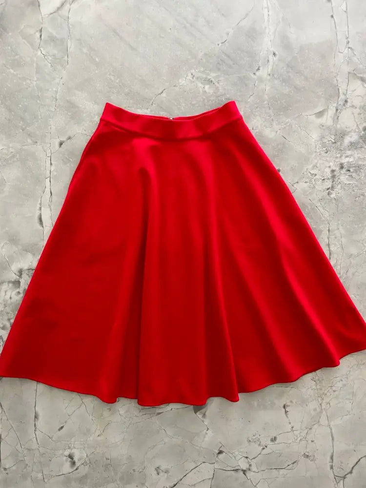 Charlotte Nova red high waisted plus size a line skirt made of smooth slightly shiny vibrant fabric