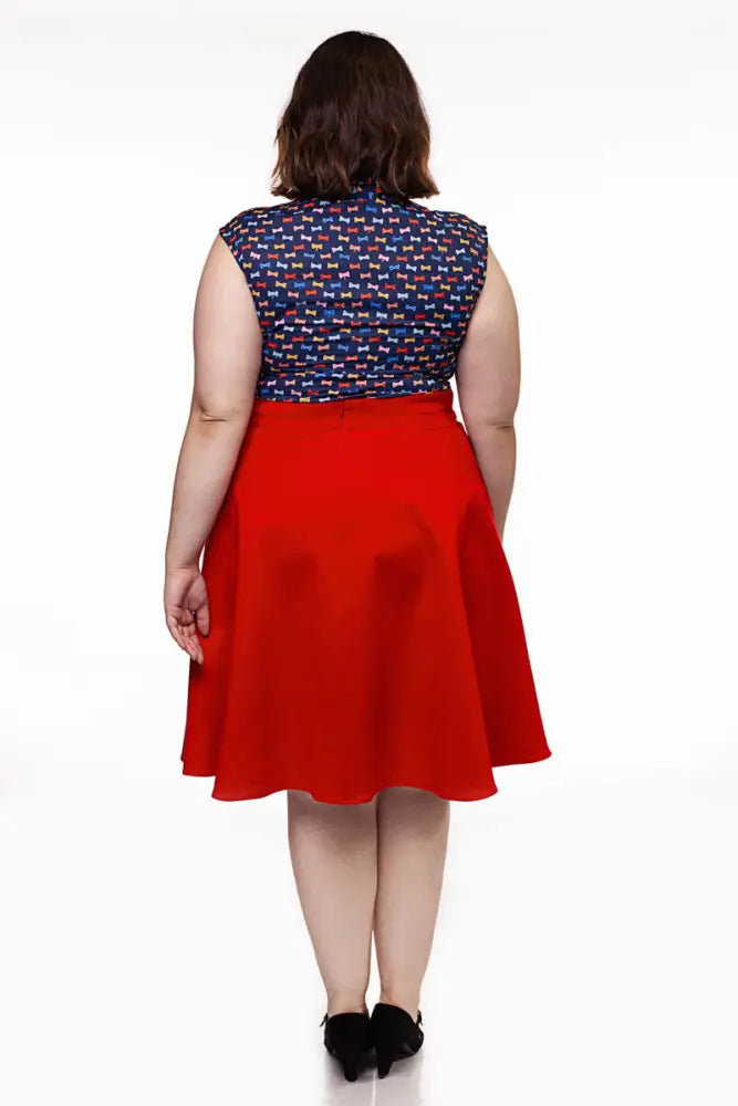 Charlotte red vintage high waisted circle skirt with pockets featuring vibrant red flared smooth flowing fabric