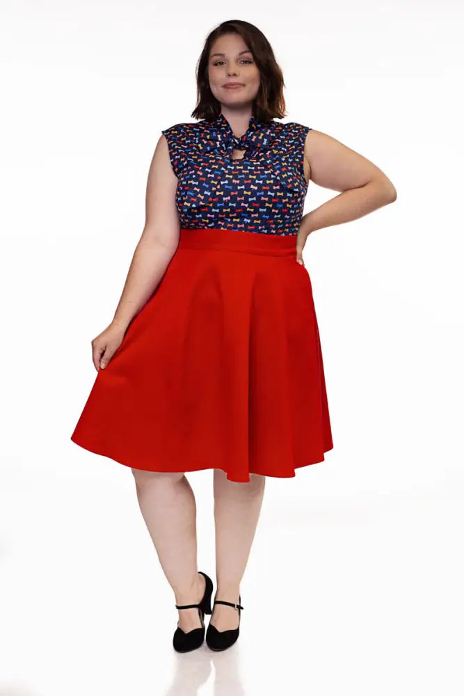A vibrant red charlotte vintage high waisted a-line circle skirt with full flared silhouette and pockets