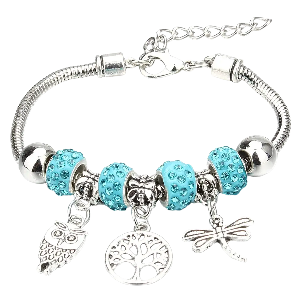 Charm bracelet with silver snake chain, turquoise rhinestone beads, and owl, tree of life, and dragonfly charms