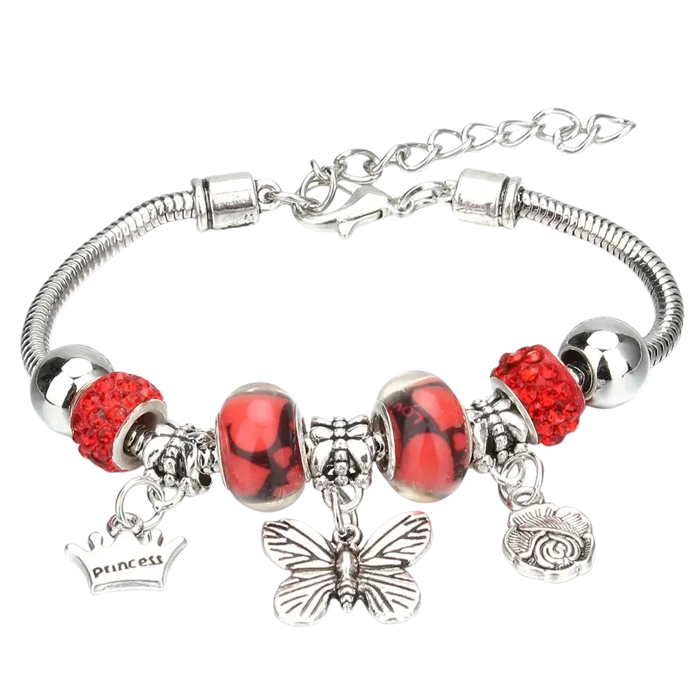 Charm bracelet with silver snake chain, red crystal and glass beads, butterfly charm, and engraved princess crown pendant