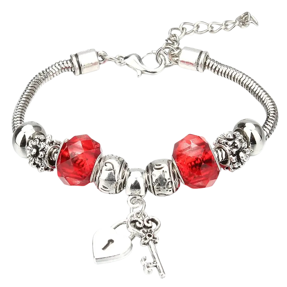 Charm bracelet with silver snake chain featuring red crystal beads and silver heart lock and key charms for women