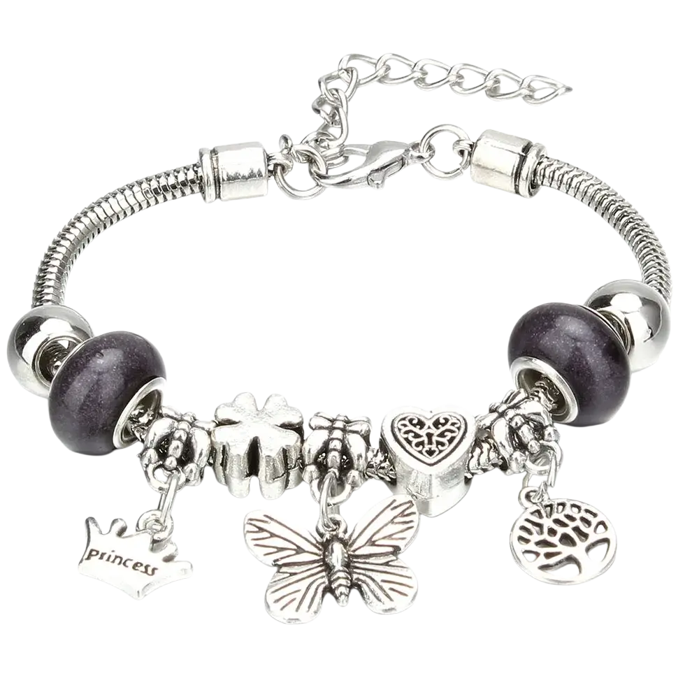 Silver-toned charm bracelet with snake chain featuring crown, key, butterfly, heart, tree of life, and purple beads beaded bracelet