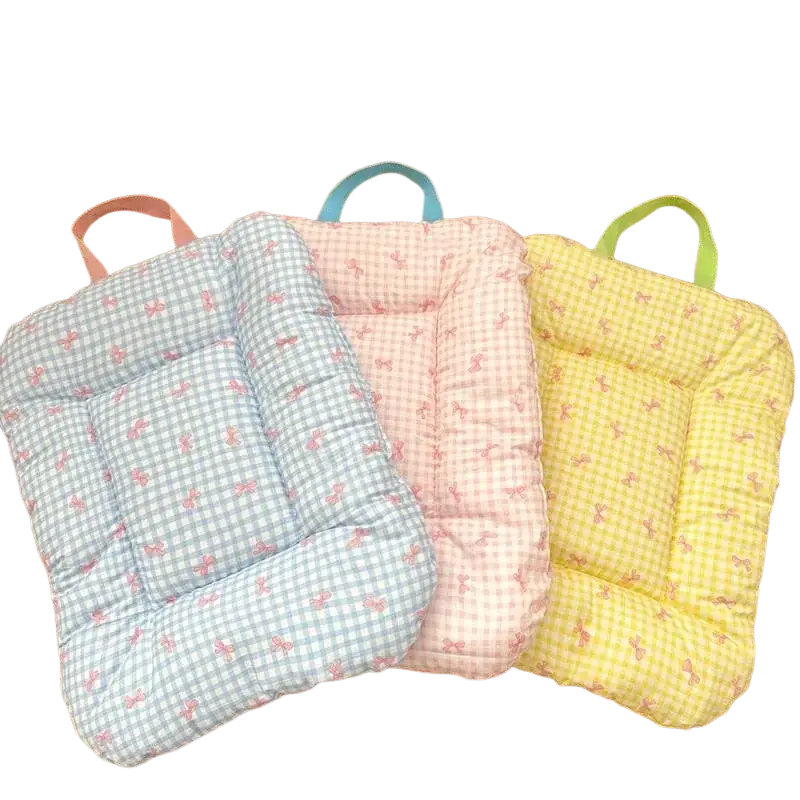Three pastel-colored quilted cotton checkered bow pet bed cushions with gingham pattern and fabric handles