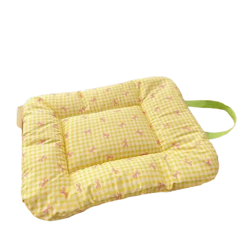 Checkered bow pet bed cotton mattress with a yellow grid cushion featuring pink bow patterns and a green strap