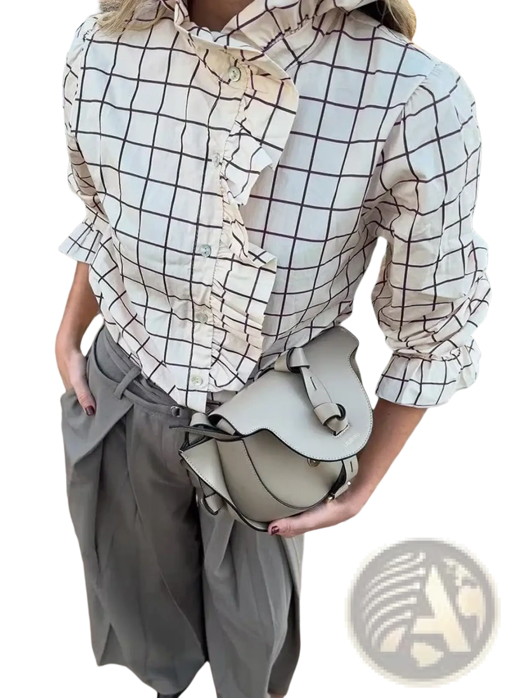 Beige leather saddle bag with minimalist design and adjustable strap paired with checkered ruffled chiffon blouse