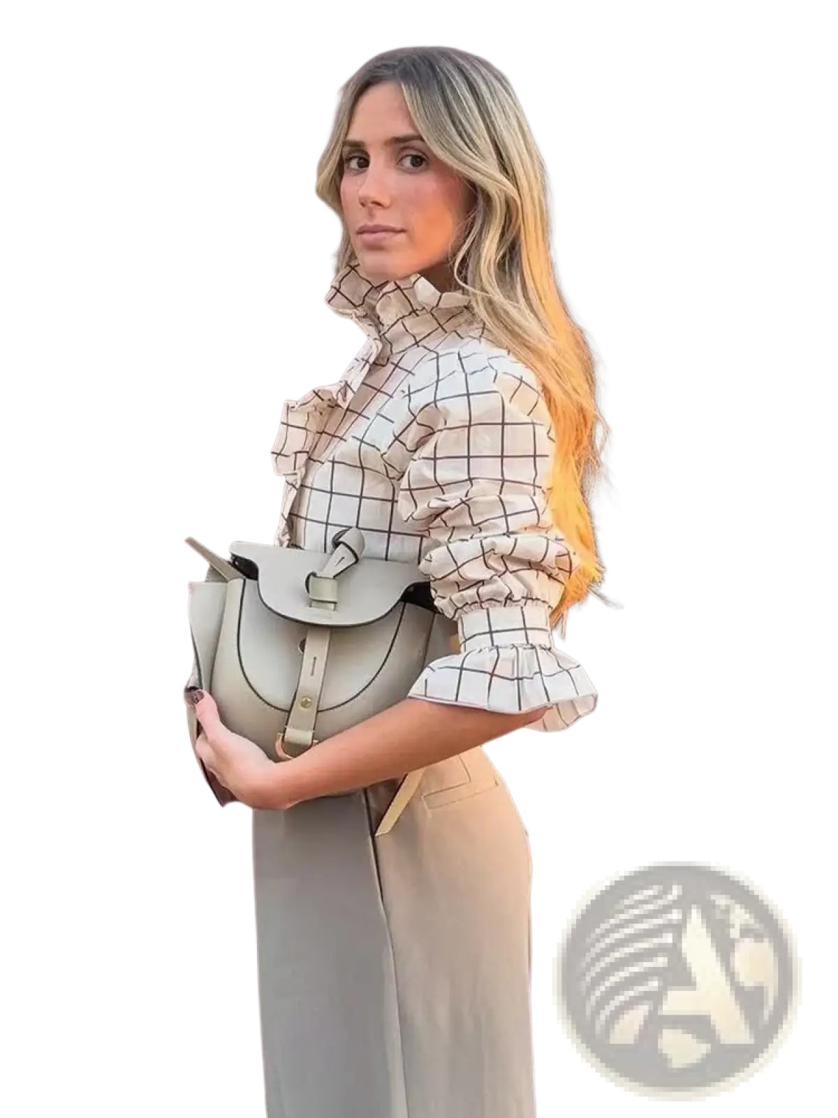 Light gray leather saddle bag with structured shape and adjustable strap paired with checkered ruffled chiffon blouse