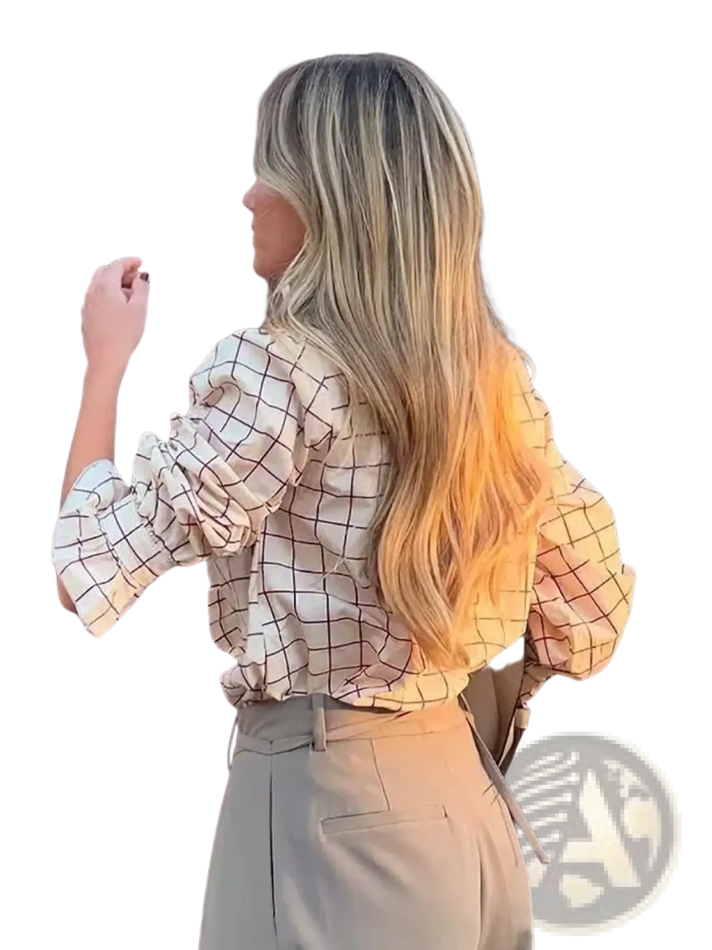 A woman wears a beige and black grid-patterned checkered ruffled chiffon blouse with puffed sleeves