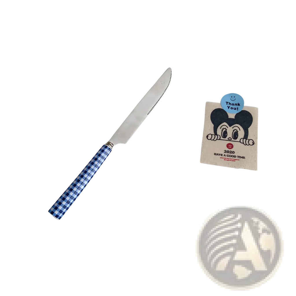 A blue and white checkered handle knife with a serrated stainless steel blade from a cutlery tableware set
