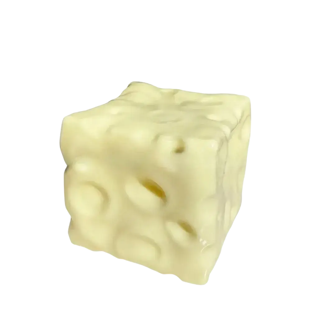 Cream-colored cube-shaped cheese block stress relief squeeze toy with characteristic holes and glossy finish