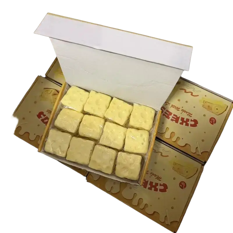 A box of pale yellow square cheese fidget toy slices 6cm x 6cm wrapped in plastic for stress relief use