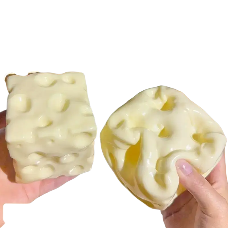Cream-colored squishy cheese fidget toy 6cm × 6cm with textured swiss cheese holes for stress relief