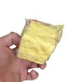 Yellow cheese-shaped fidget toy 6cm x 6cm with holes and glossy plastic wrap for stress relief