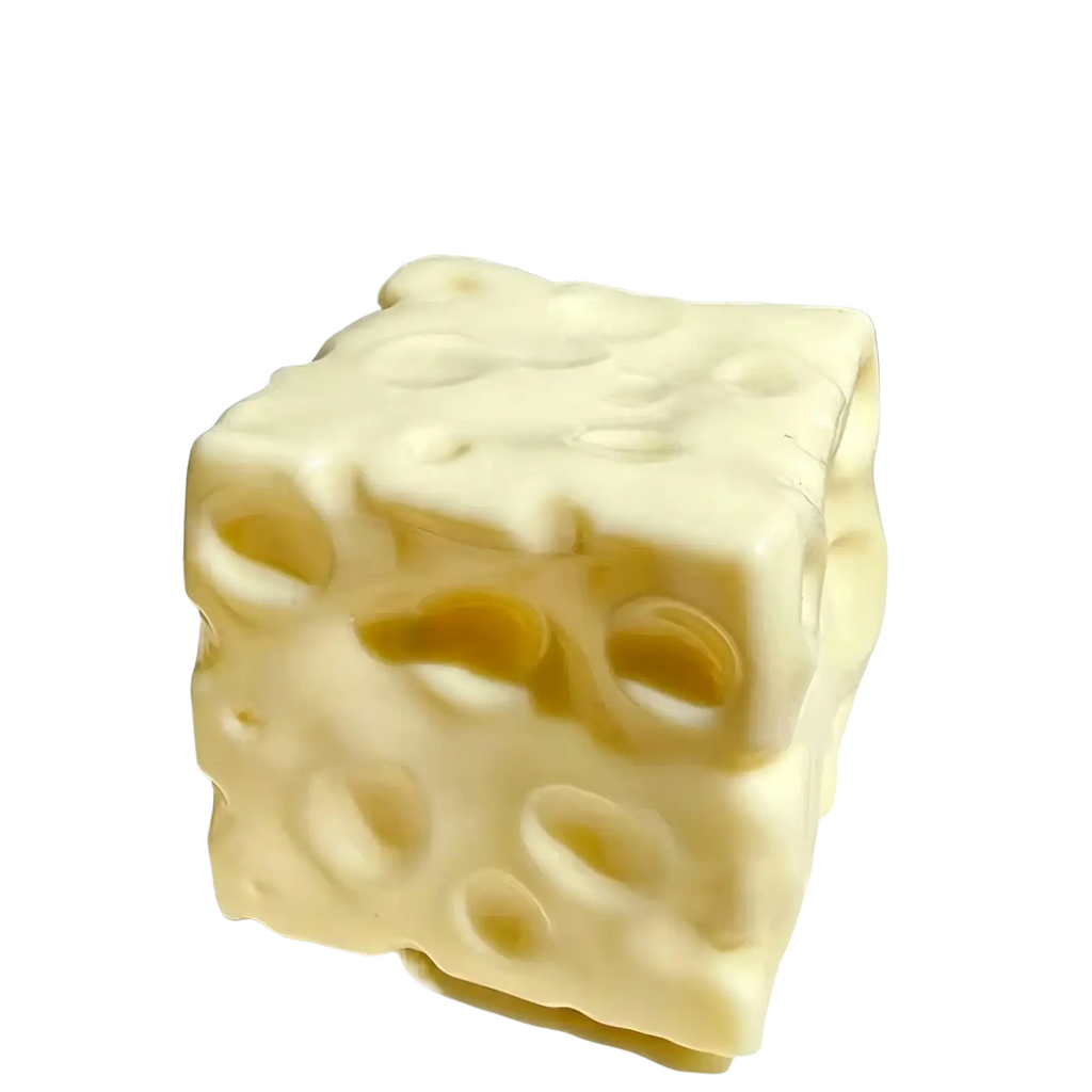 Cream-colored cube-shaped cheese squishy toy with textured surface and holes for slow rising sensory stress relief
